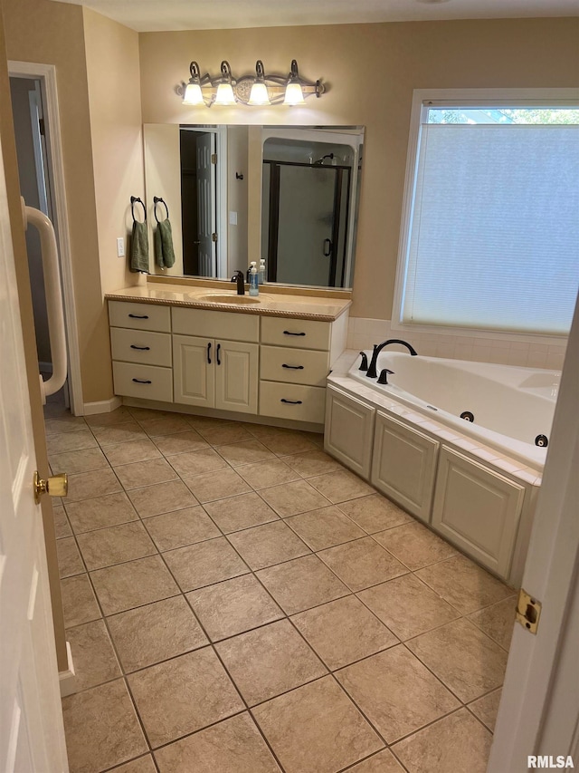 bathroom with vanity, shower with separate bathtub, and tile patterned floors