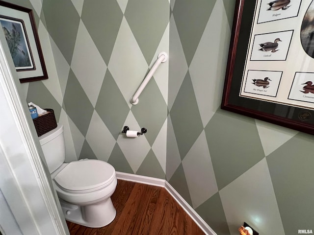 bathroom featuring wood-type flooring and toilet