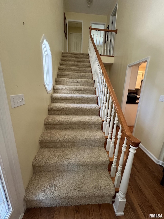 1803 N Dawn Dr, Marion, IL 62959 - staircase featuring baseboards and wood finished floors