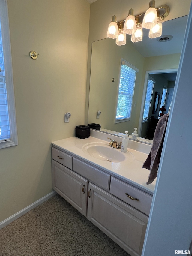 1803 N Dawn Dr, Marion, IL 62959 - ensuite bathroom with vanity, ensuite bathroom, baseboards, and visible vents