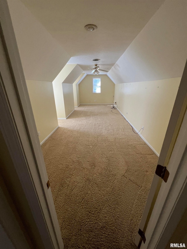 bonus room featuring vaulted ceiling, ceiling fan, and light colored carpet