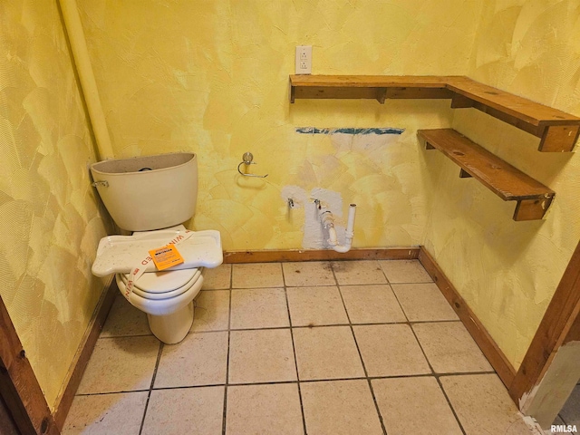 bathroom featuring tile patterned flooring and toilet