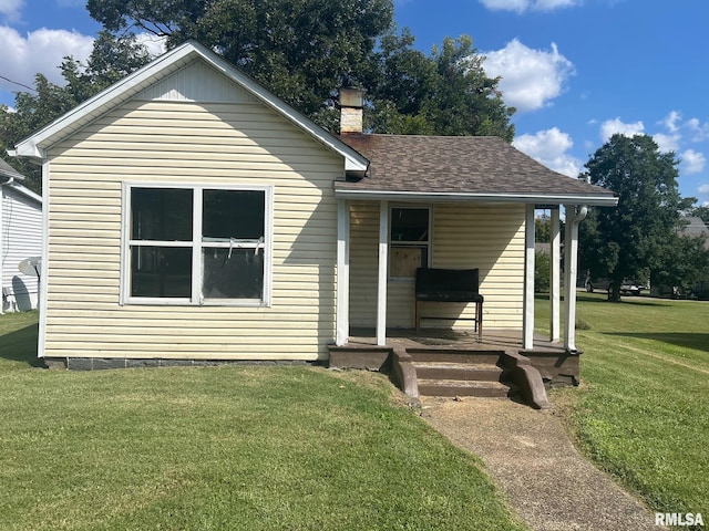 view of front of house featuring a front yard and covered porch