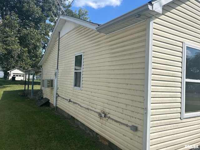 view of side of property with a lawn