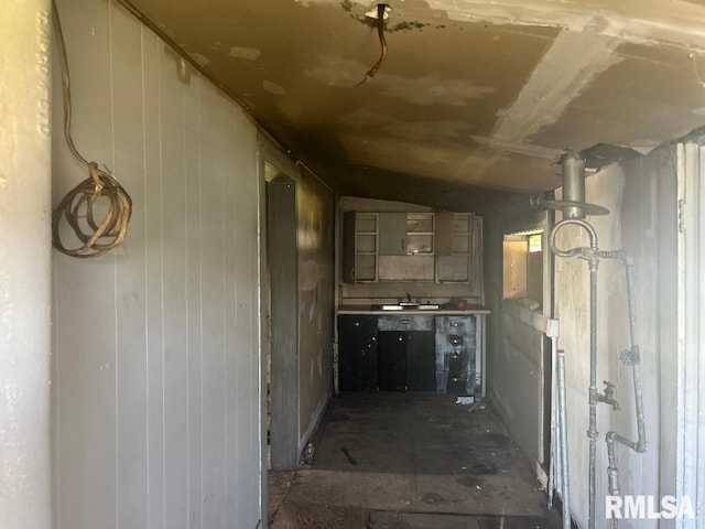 hallway featuring lofted ceiling