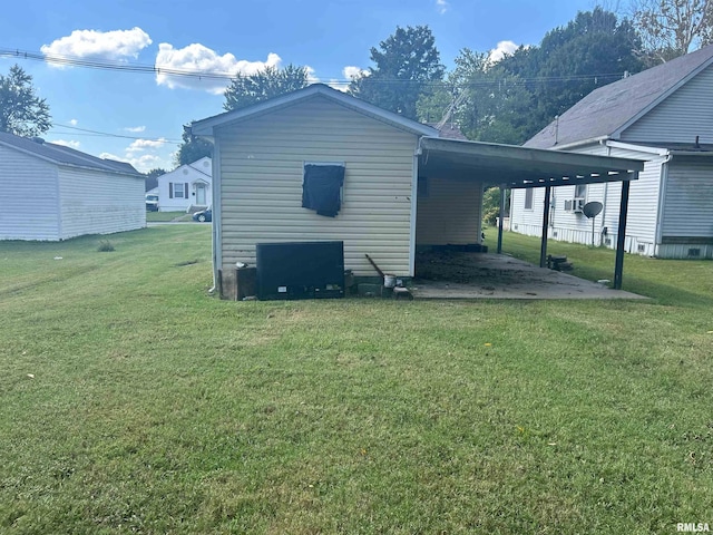 exterior space with a lawn and a carport