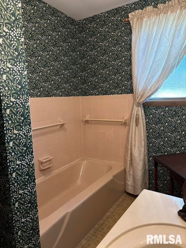 bathroom featuring a bathtub and tile patterned flooring