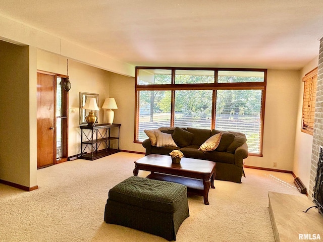 carpeted living room with a fireplace and baseboards