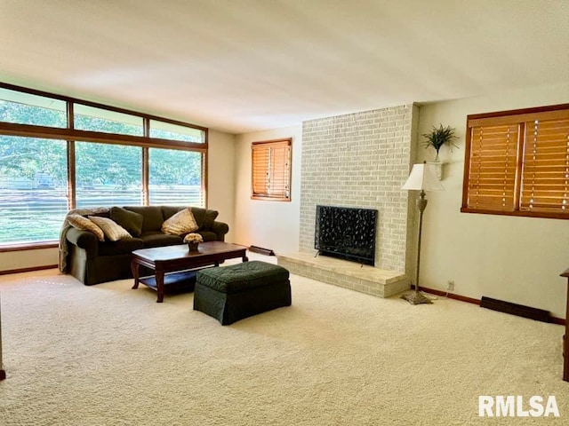 living area with carpet floors, a fireplace, and baseboards