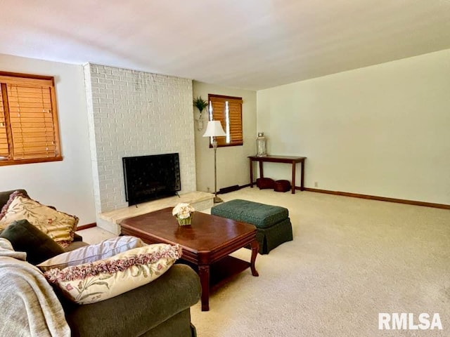 carpeted living room featuring a fireplace and baseboards