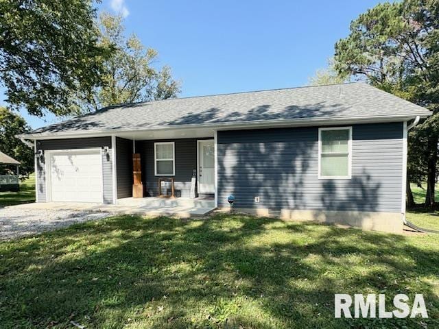 ranch-style home with a garage, a front lawn, and covered porch