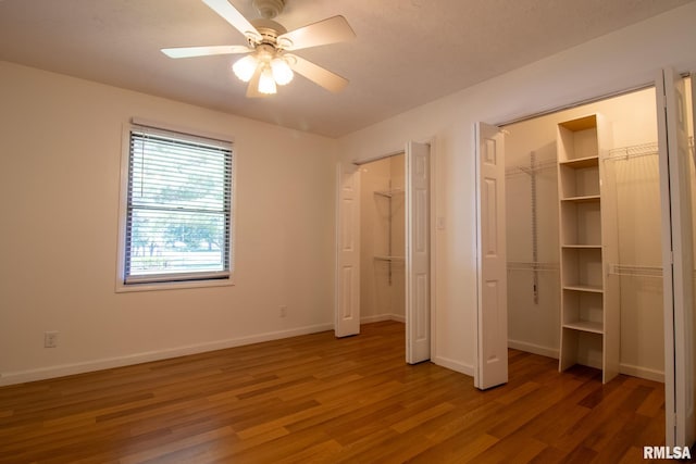 unfurnished bedroom featuring ceiling fan and wood-type flooring