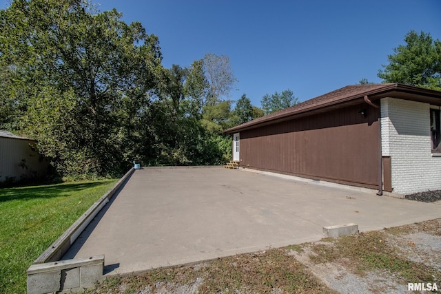 view of property exterior featuring a lawn