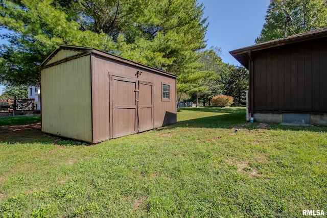 view of outdoor structure with a lawn