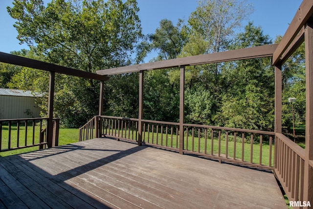 wooden deck with a lawn