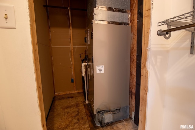 utility room featuring heating unit