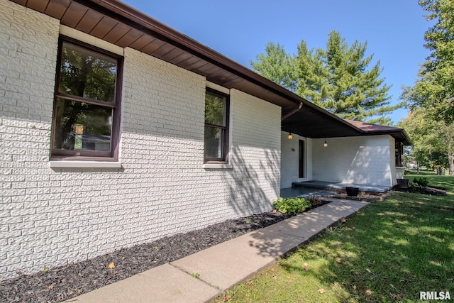 view of property exterior with a yard