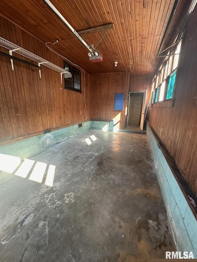 garage with wooden walls and wooden ceiling