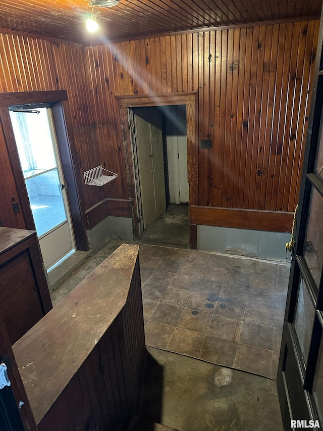 bathroom featuring wooden ceiling and wood walls