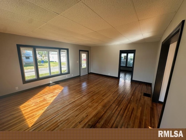 interior space with a healthy amount of sunlight and dark hardwood / wood-style flooring