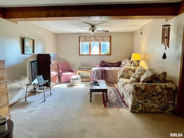 carpeted living room featuring beamed ceiling and ceiling fan