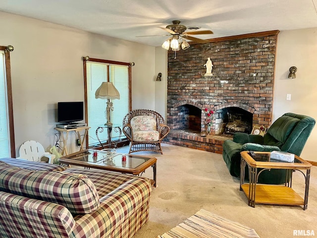 living room featuring a brick fireplace, light colored carpet, a textured ceiling, and ceiling fan