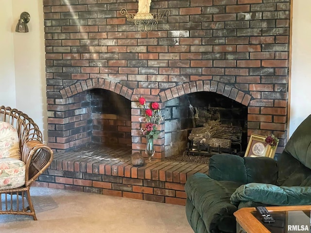 details featuring carpet and a brick fireplace