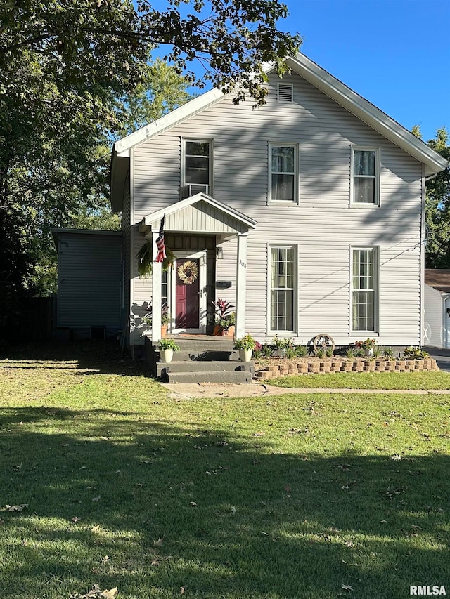 view of front of home with a front lawn