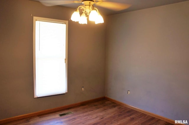 empty room with wood-type flooring and ceiling fan