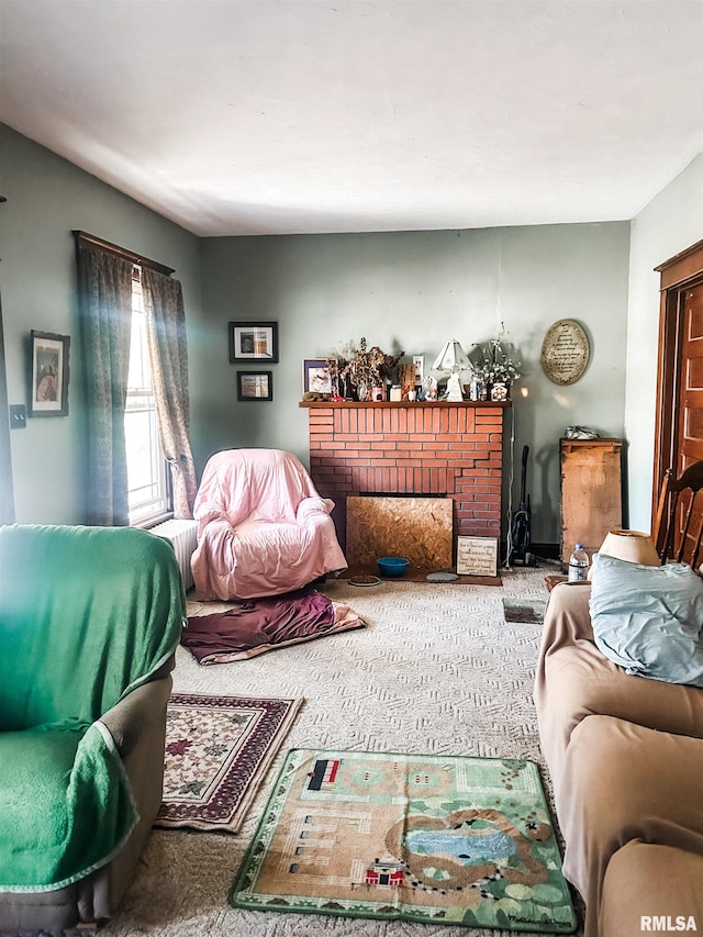 carpeted living room with a fireplace