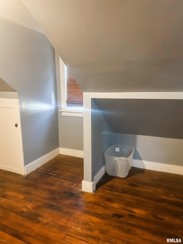 interior space with wood-type flooring and vaulted ceiling