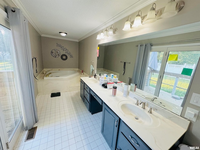 bathroom featuring vanity, tile patterned floors, tiled tub, ornamental molding, and a textured ceiling