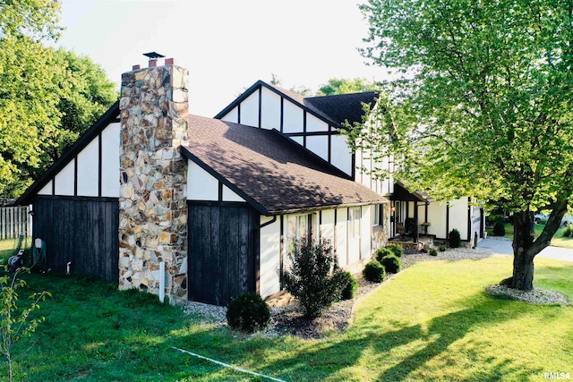 view of side of home featuring a yard