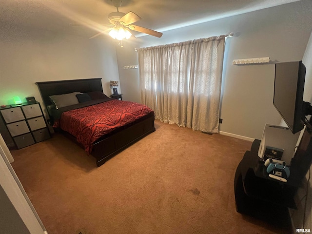 bedroom with ceiling fan and carpet