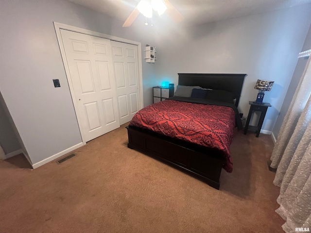 carpeted bedroom featuring ceiling fan and a closet