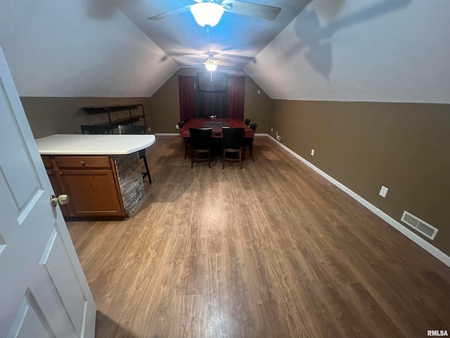 office space featuring lofted ceiling, ceiling fan, and light wood-type flooring