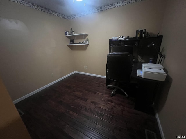 office with visible vents, baseboards, and wood finished floors