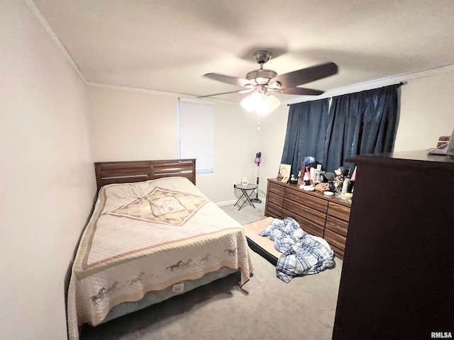 bedroom featuring carpet floors, crown molding, and ceiling fan