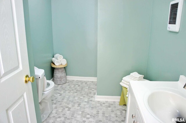 bathroom with vanity and toilet