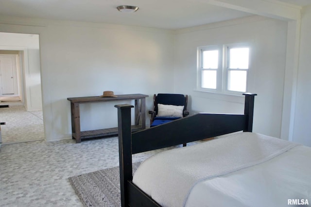 carpeted bedroom featuring crown molding