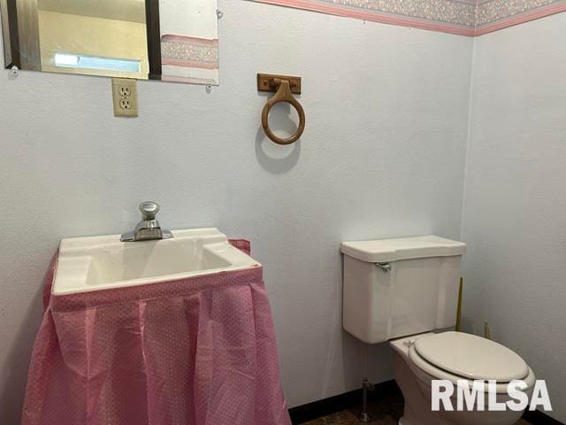 bathroom featuring toilet