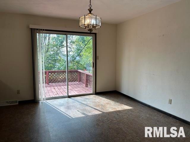 unfurnished dining area featuring a notable chandelier