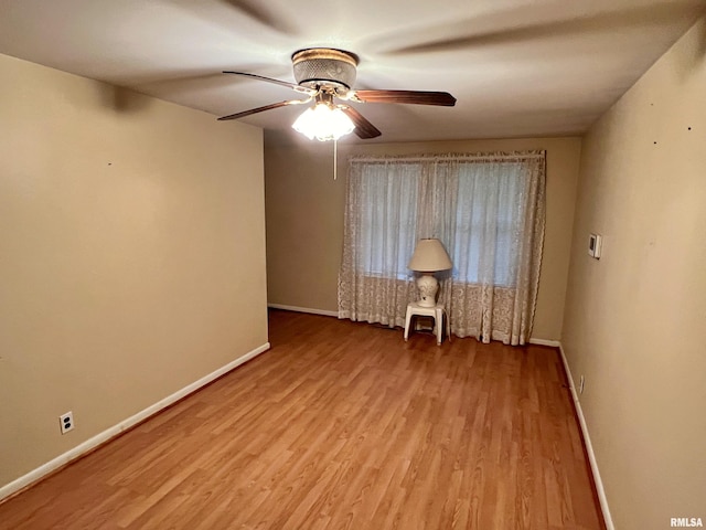 empty room with light hardwood / wood-style floors and ceiling fan