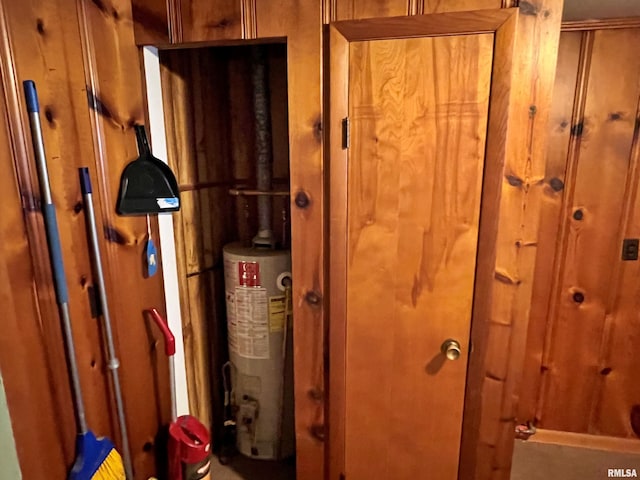 utility room featuring gas water heater