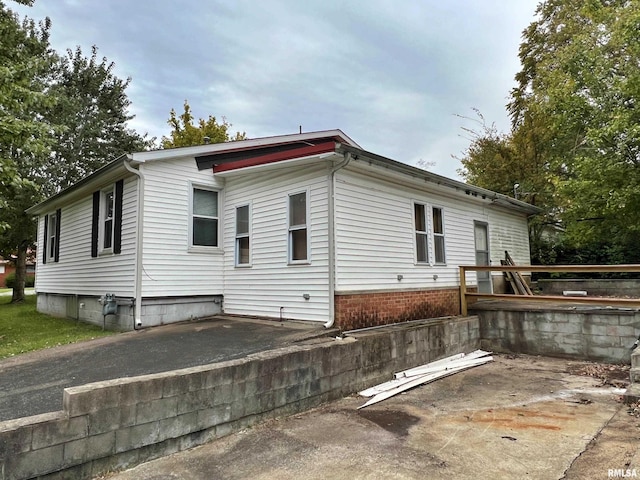 view of home's exterior with a patio