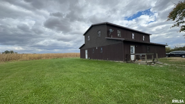 view of property exterior with a lawn