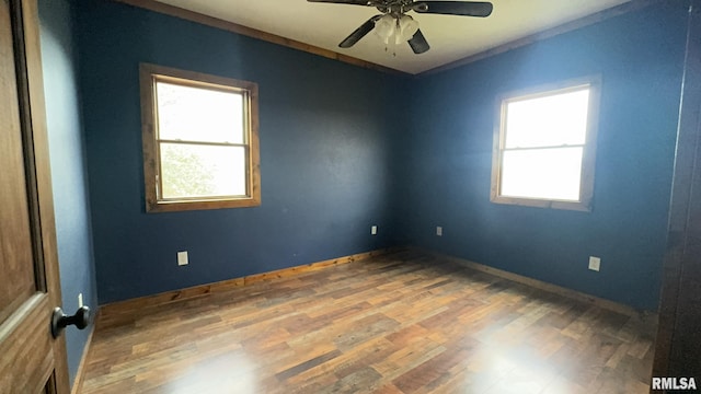 empty room with ceiling fan and wood-type flooring