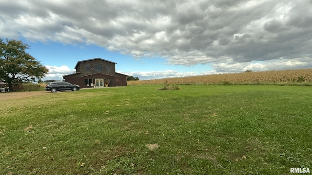 view of yard with a rural view