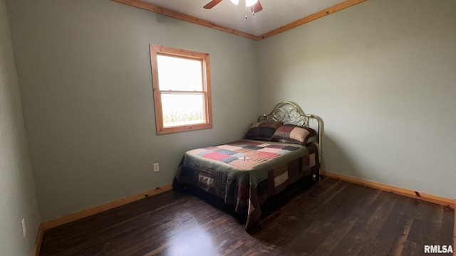 bedroom featuring crown molding, ceiling fan, and dark hardwood / wood-style floors