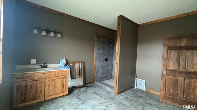 bathroom featuring vanity and a shower